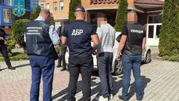 Vámos és társa bíróság előtt: 16 ezer dollárért csempésztek volna katonaköteles férfiakat Romániába. Fotó: Kárpátaljai Megyei Ügyészség